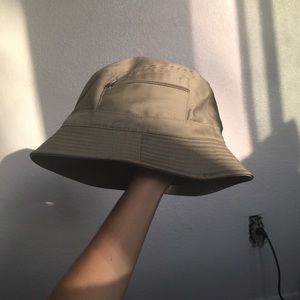 Tan bucket hat with zipper details